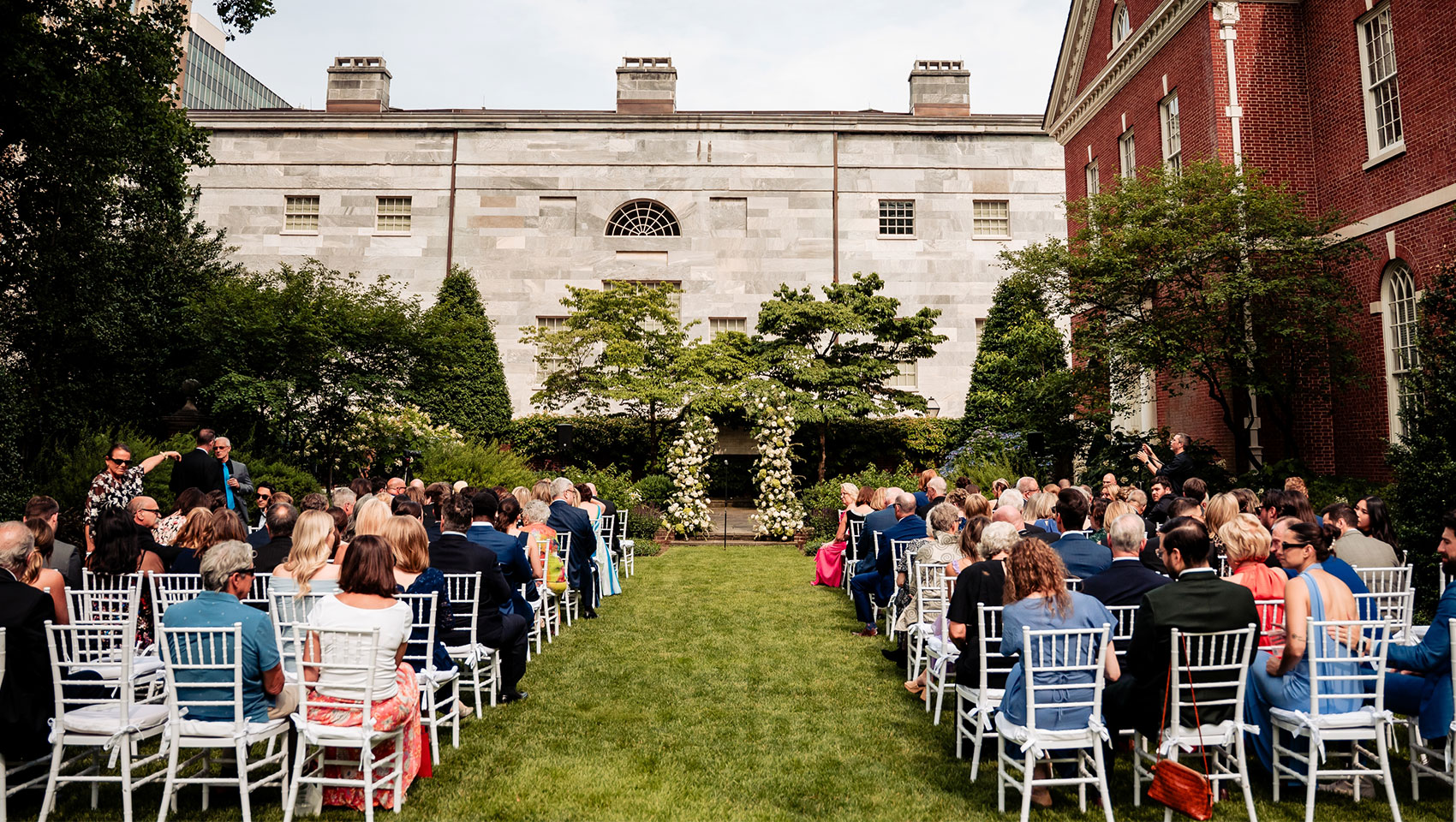 Thomas Jefferson Garden wedding seating setup with guests in white chairs