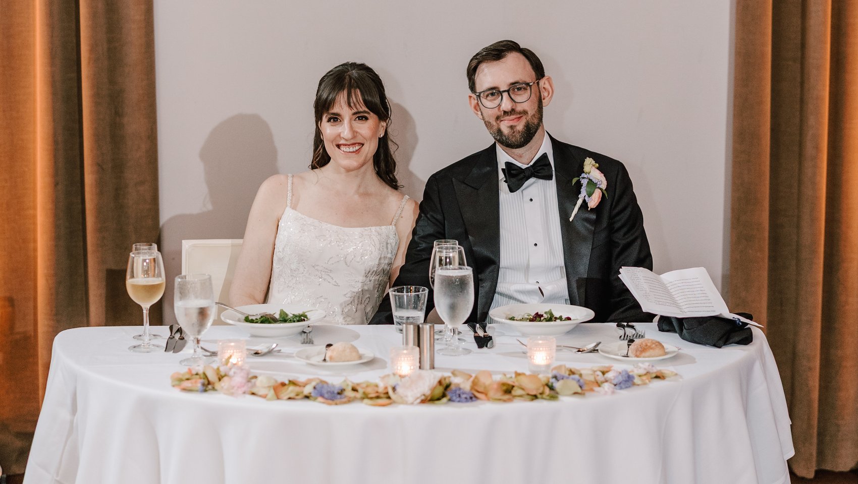 Jaclyn and Simon at the sweetheart table at their reception