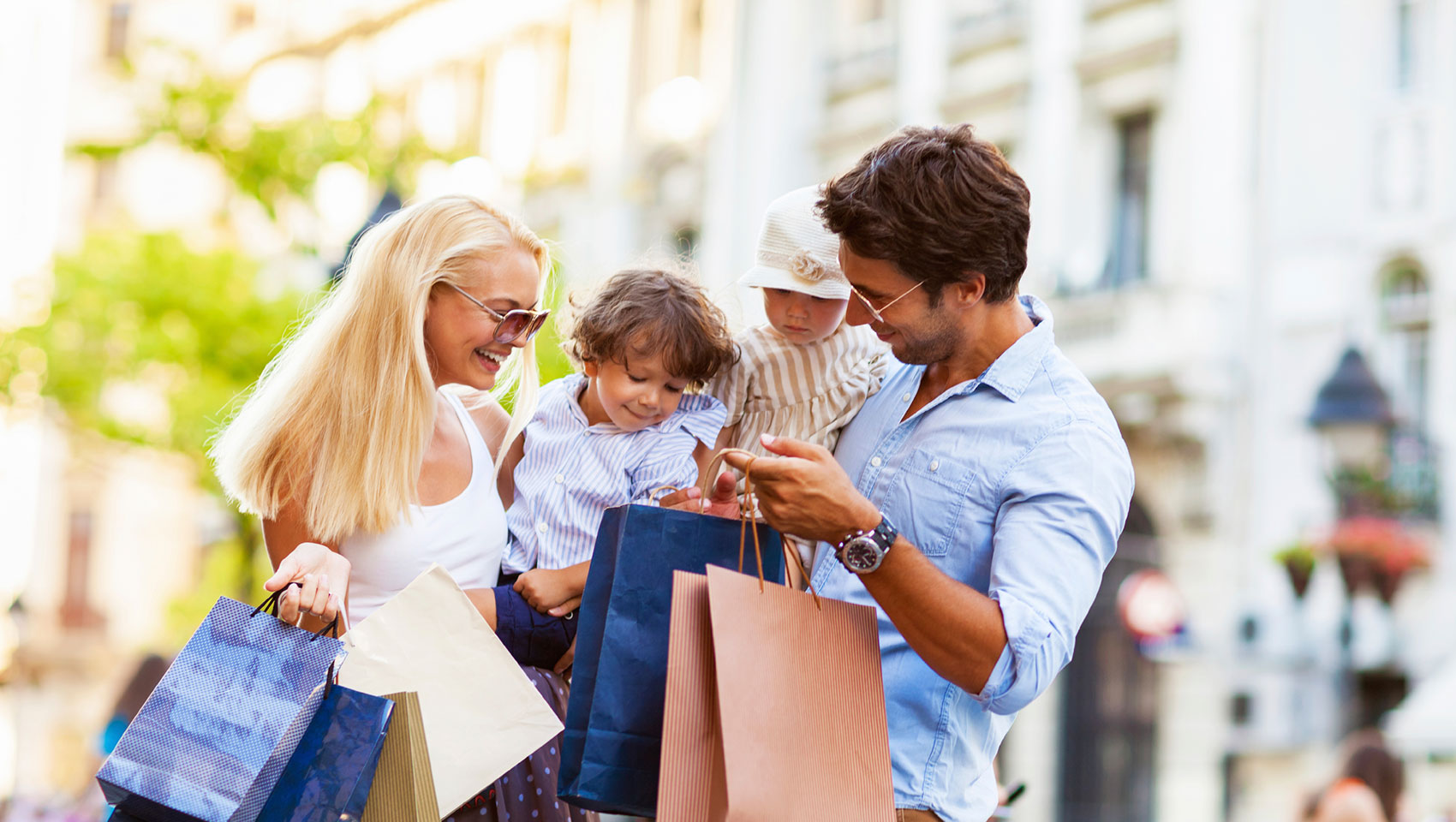 Family with shopping bags