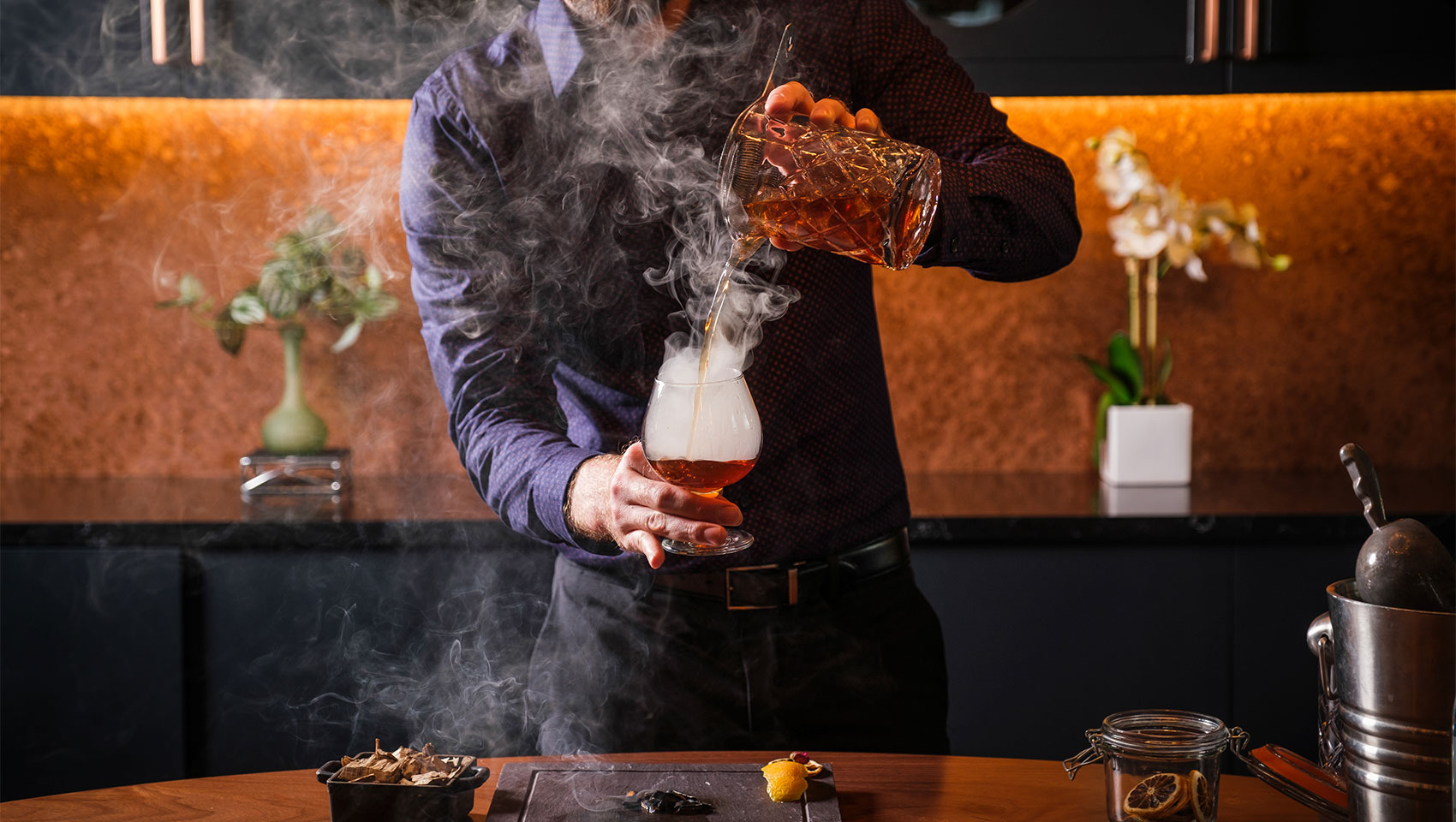 stratus lounge bartender making a drink