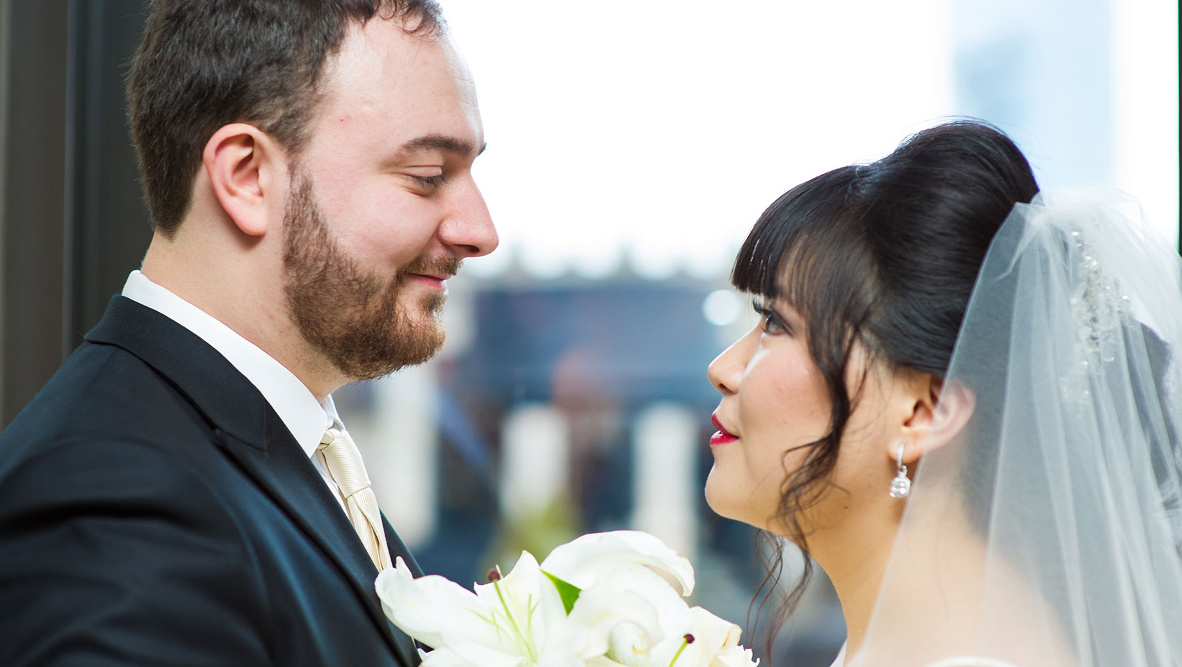 Bride and groom looking at each other