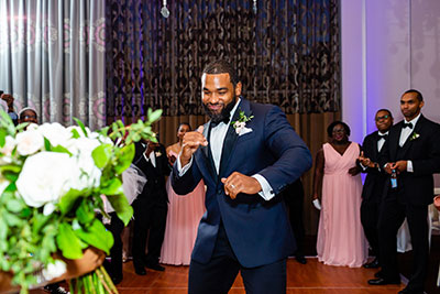 Groom dancing amongst guests