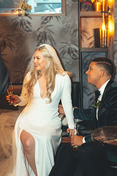 Newlyweds enjoy a cocktail