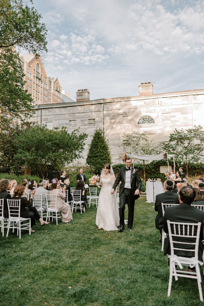 Bride and groom walking the aisle at Thomas Jefferson Garden