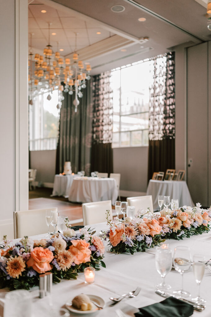 Wedding reception tables with floral centerpieces