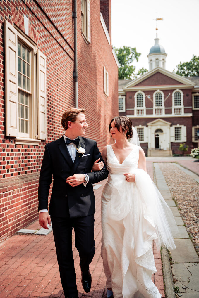 Bride and groom walking through Old City Philadelphia