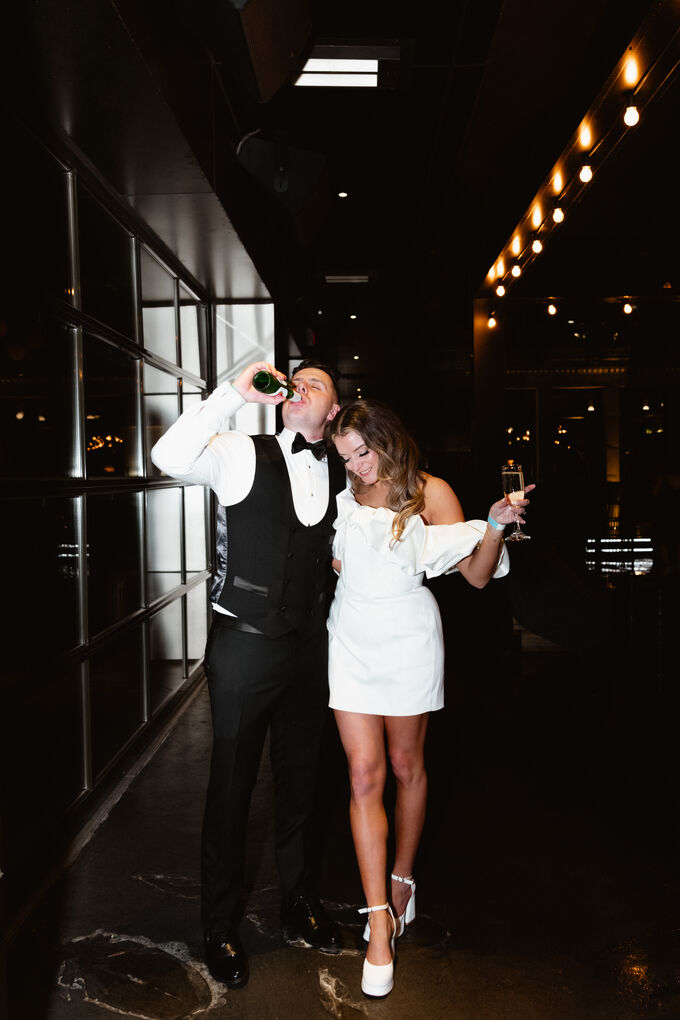 Couple singing together at their wedding reception