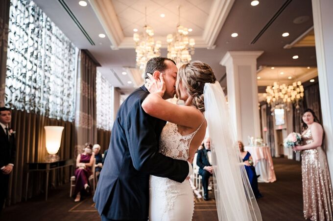 Newlyweds kissing after the ceremony