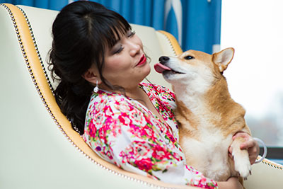 Bride pouting lips at cute dog