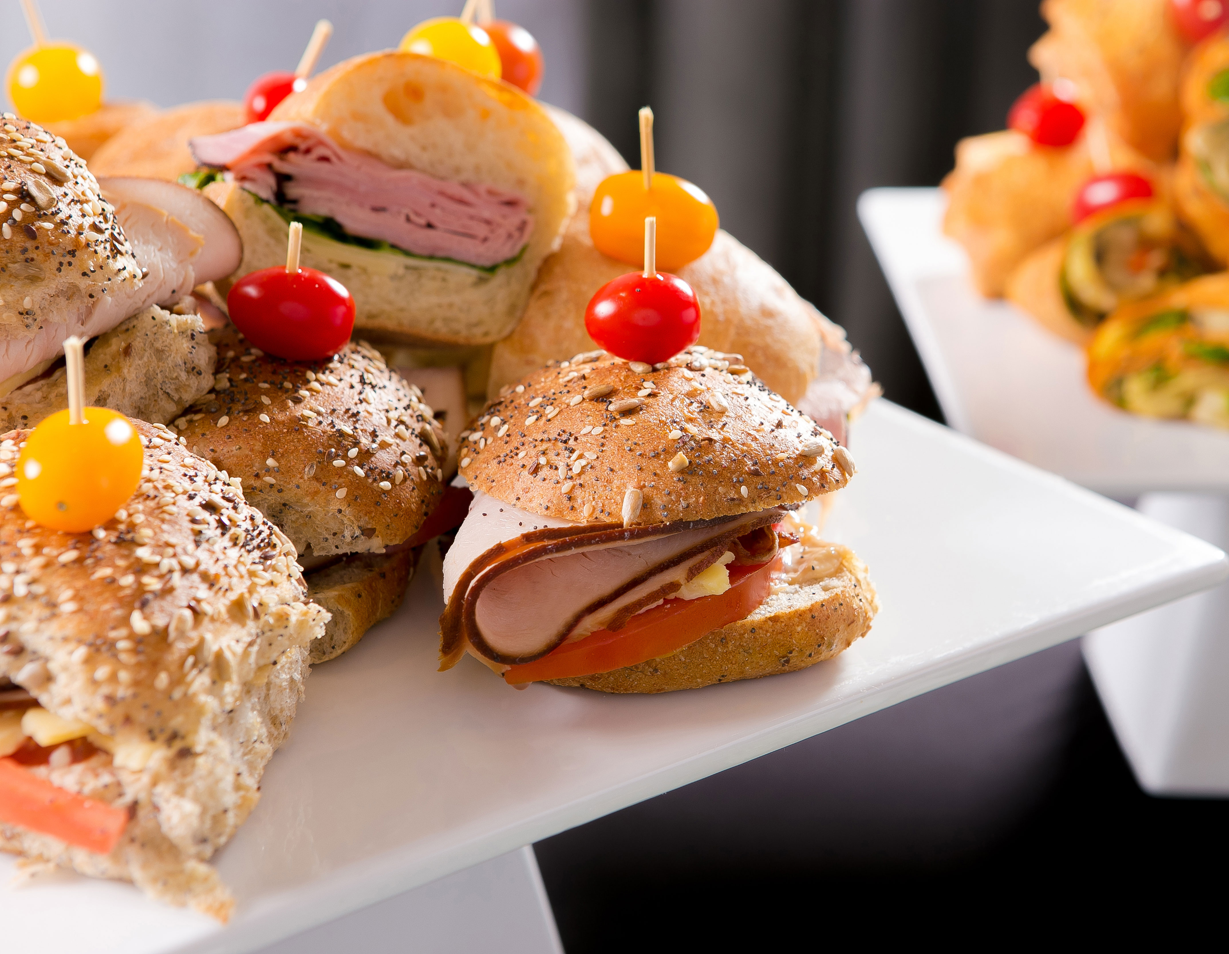 deli sandwich display on white risers for catering