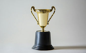 Tiny gold trophy