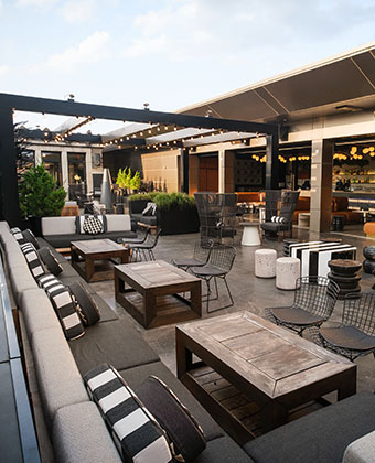 Rooftop lounge with indoor and outdoor seating