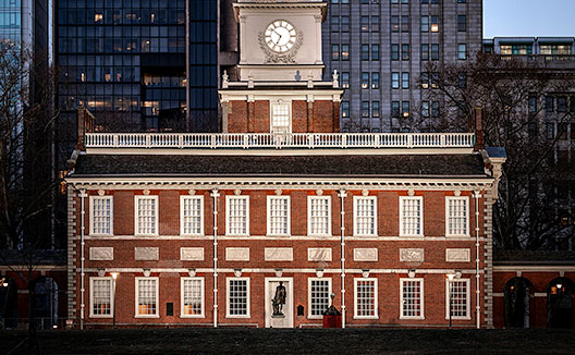 Independence Hall lit up at dusk